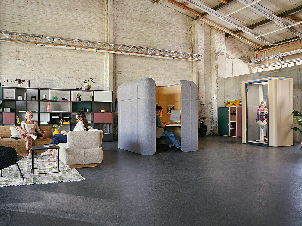 Spacious modern office environment with an industrial character and a variety of work, seating and retreat areas.