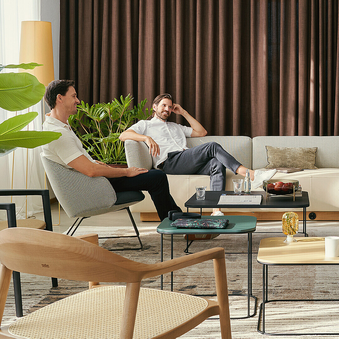 Ppeople sit in a communicative zone in the office